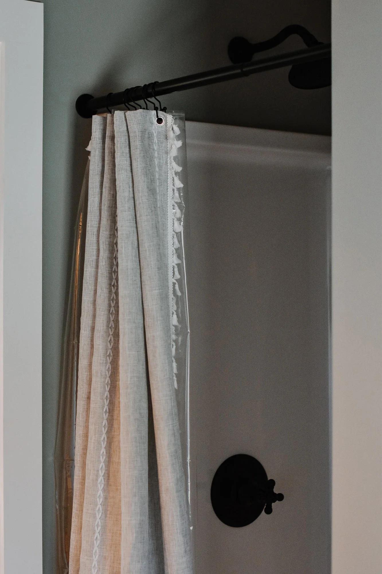 rustic modern farmhouse bathroom details, industrial standup shower, cotton curtain