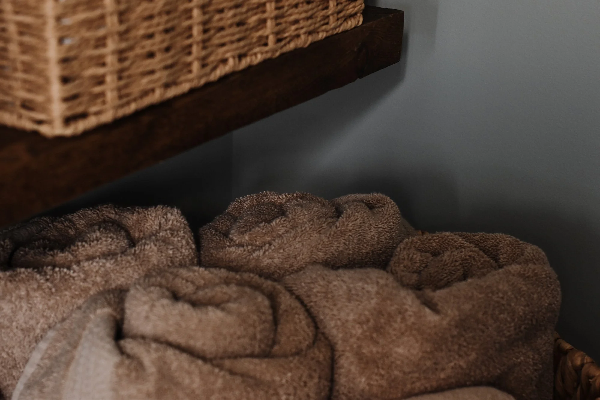 rustic modern farmhouse bathroom cotton towles in basket storage