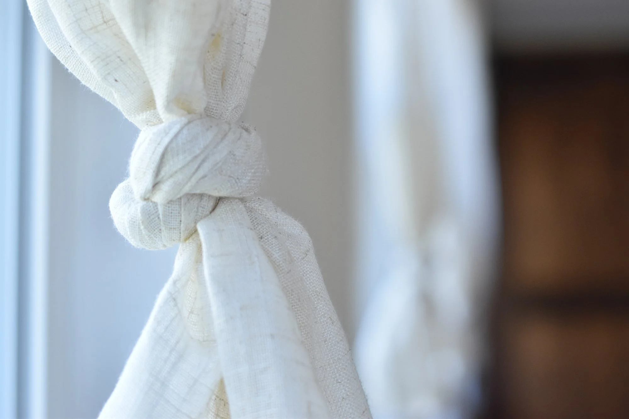 1890 Farmhouse Dining Room Windows with Linen Curtains Tied in a Knot