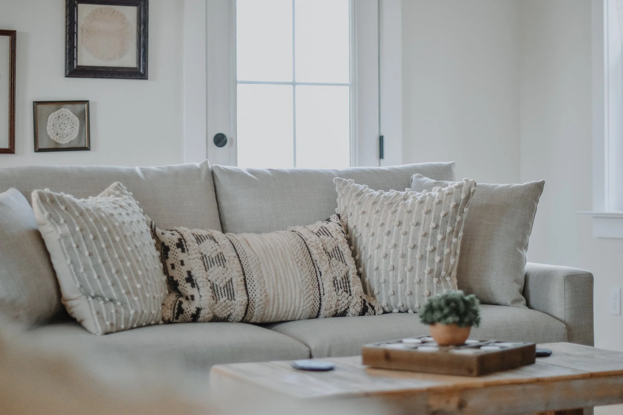 Cozy light linen farmhouse sitting room with cotton pillows