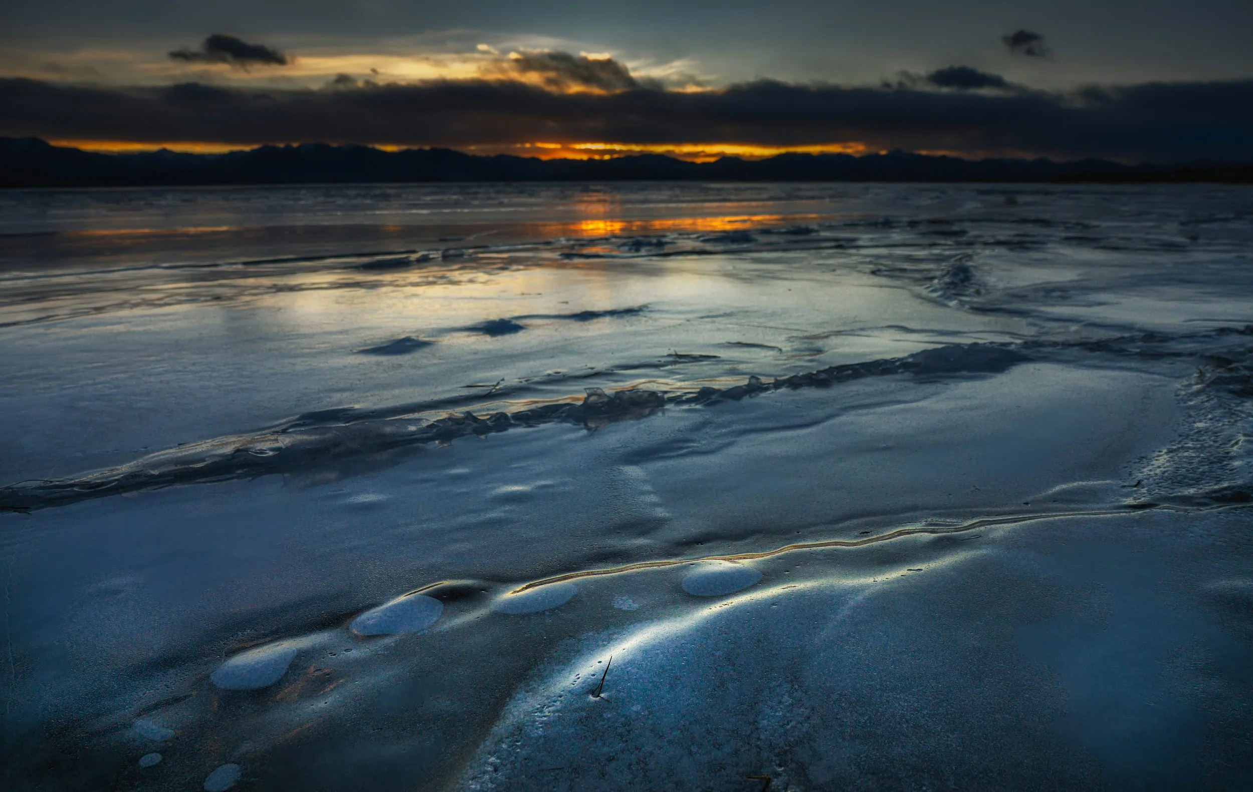 Geometric drawing of an outline square with sections divided by vertical, horizontal, and diagonal lines.