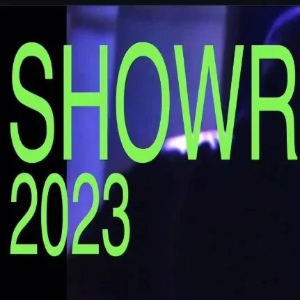 Green text on a dark background reads "SHOW 2023".