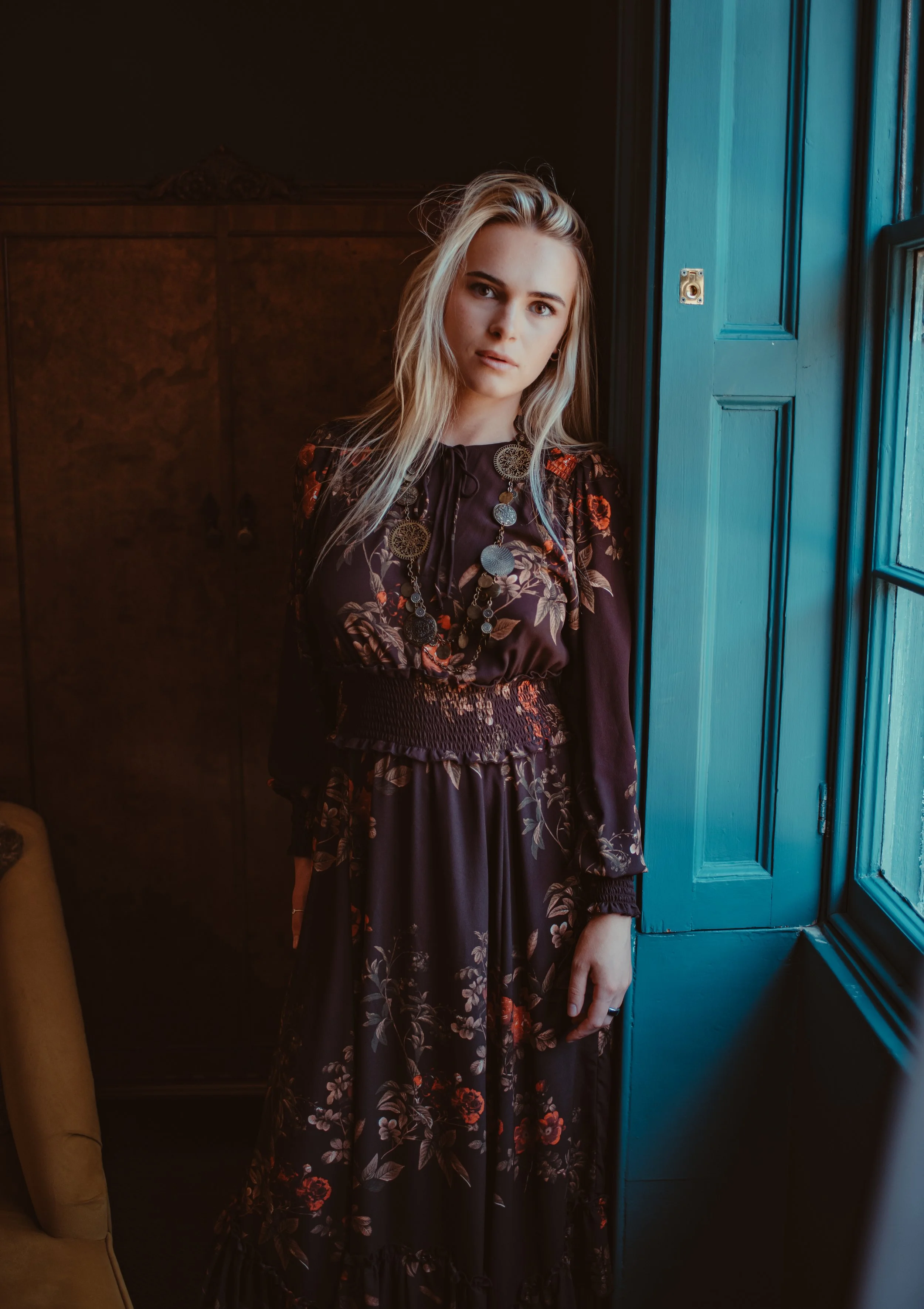 Fashion model Amy Stubbs wearing lush chocolate brown maxi dress in opulent Georgian town house, in Peak District Fashion Shoot 