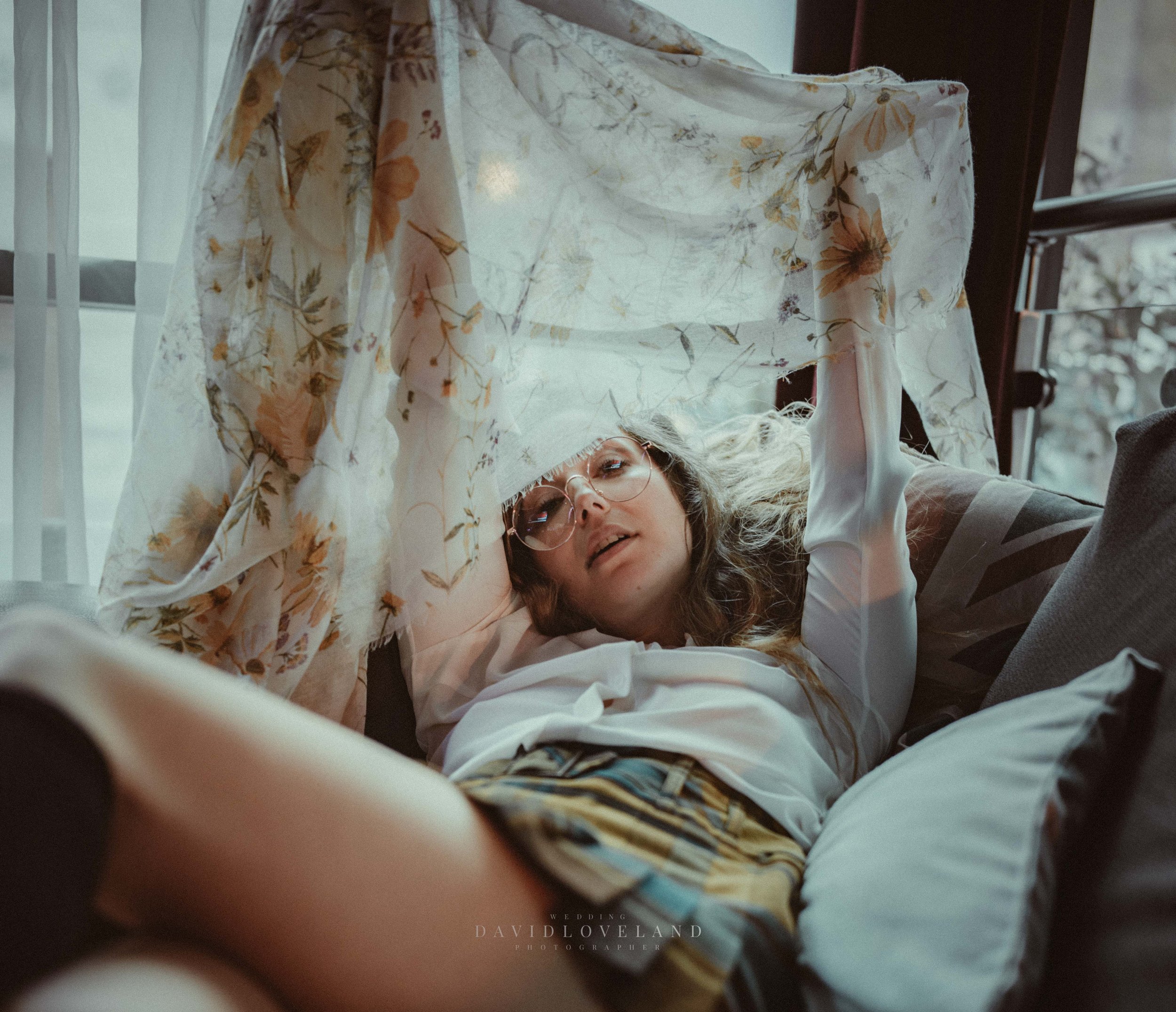 Fashion model wearing Karen Millen skirt, white blouse and floral scarf, knee high socks, spring fashion ideas. David Loveland Fashion Photography and Styling