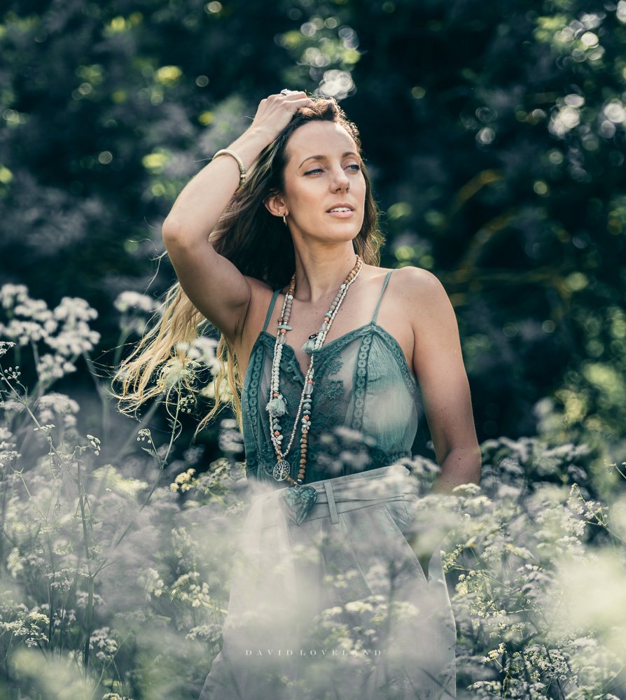 Beautiful model Naomi wearing khaki Free People bodysuit and cotton baggy trousers in summer fields. David Loveland Photography and Styling.