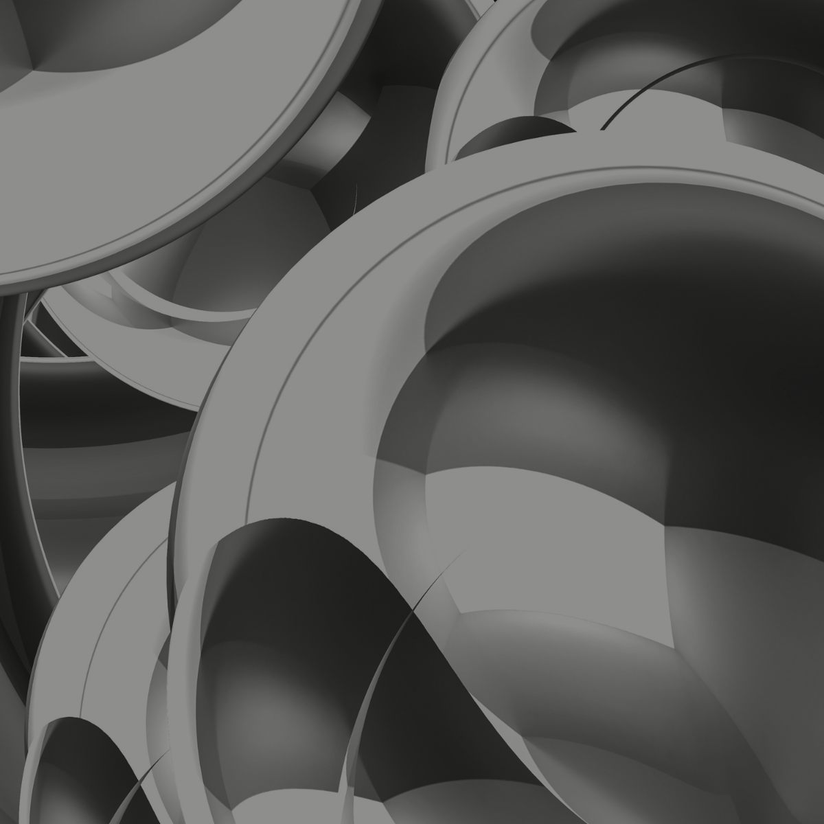 A collection of gray metal pipes with circular openings, stacked together in a close-up view.