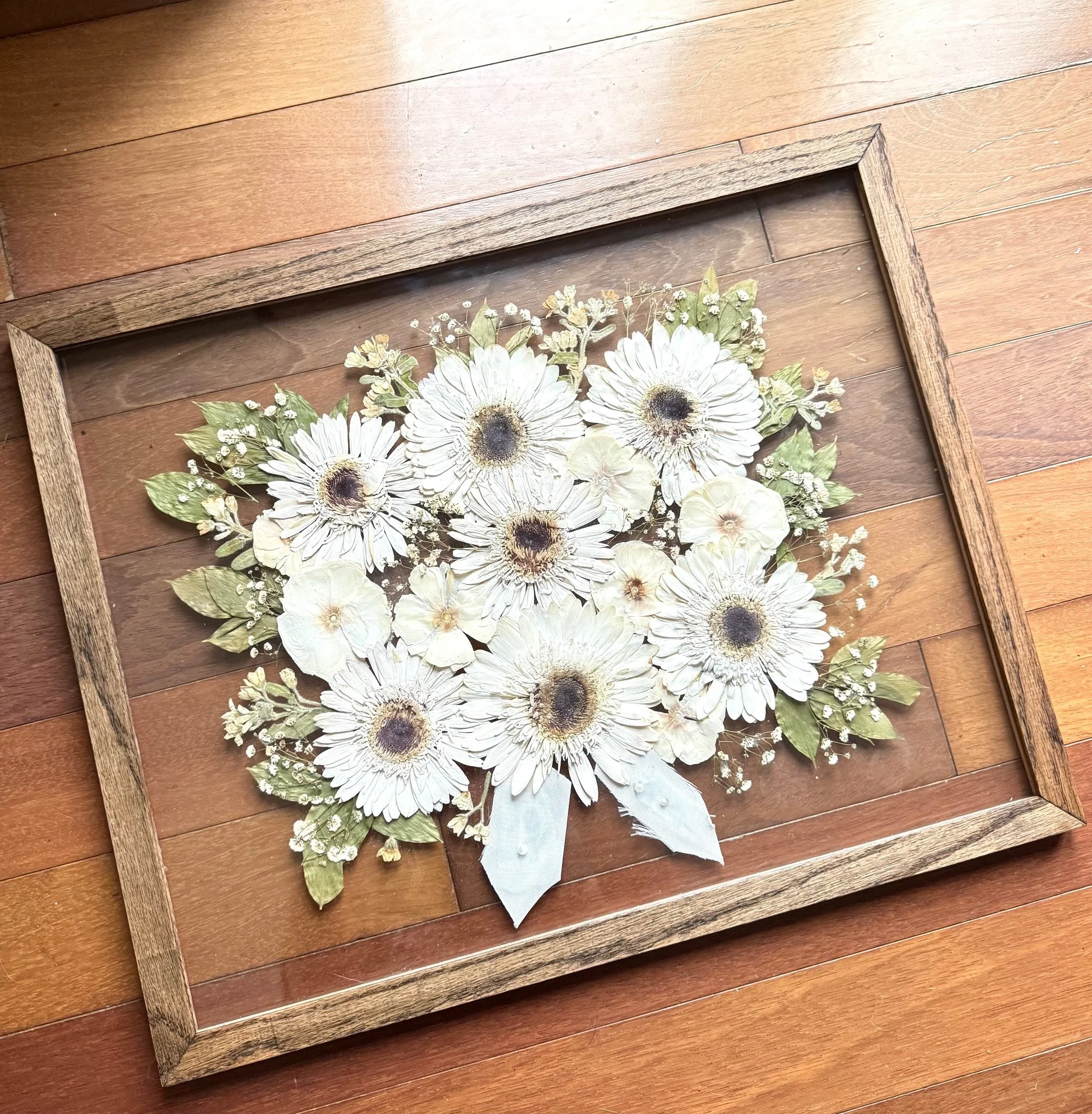 16x20 oak frame in espresso stain, incorporated pieces of her wedding dress and veil