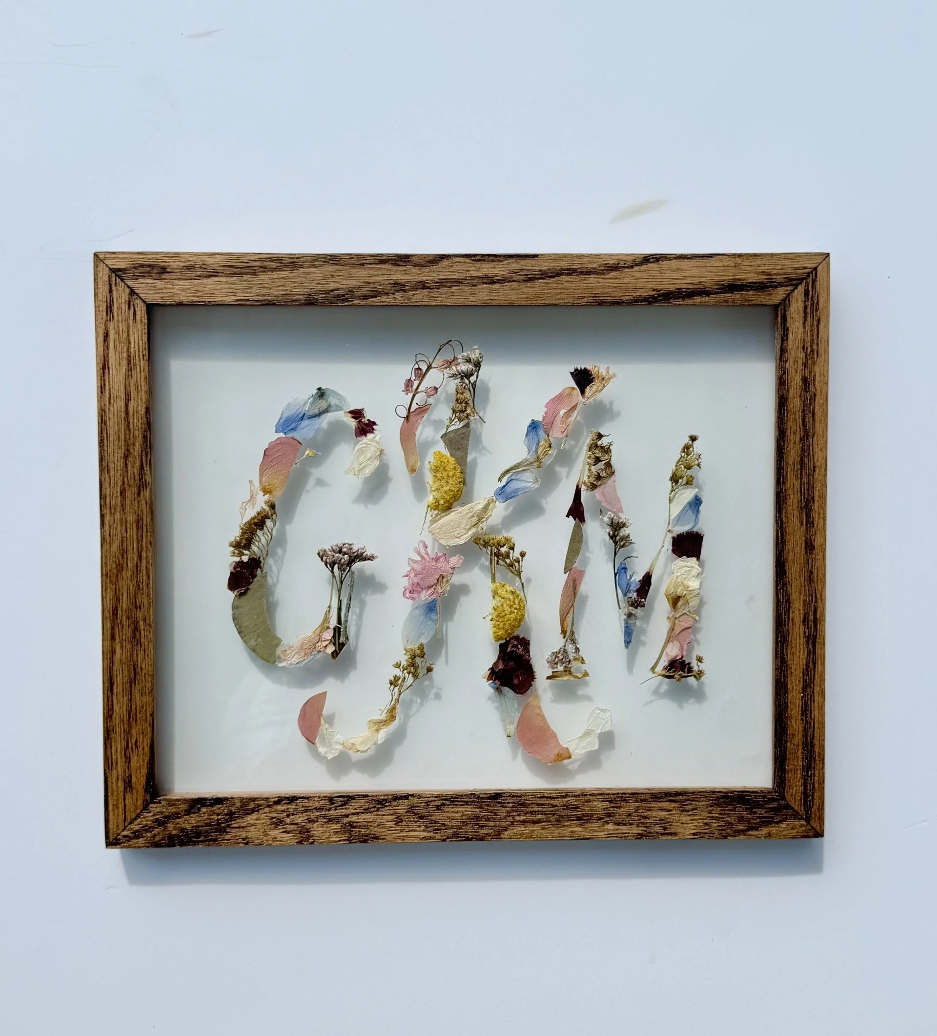 3 letter monogram in an 8x10 oak frame, stained with espresso.