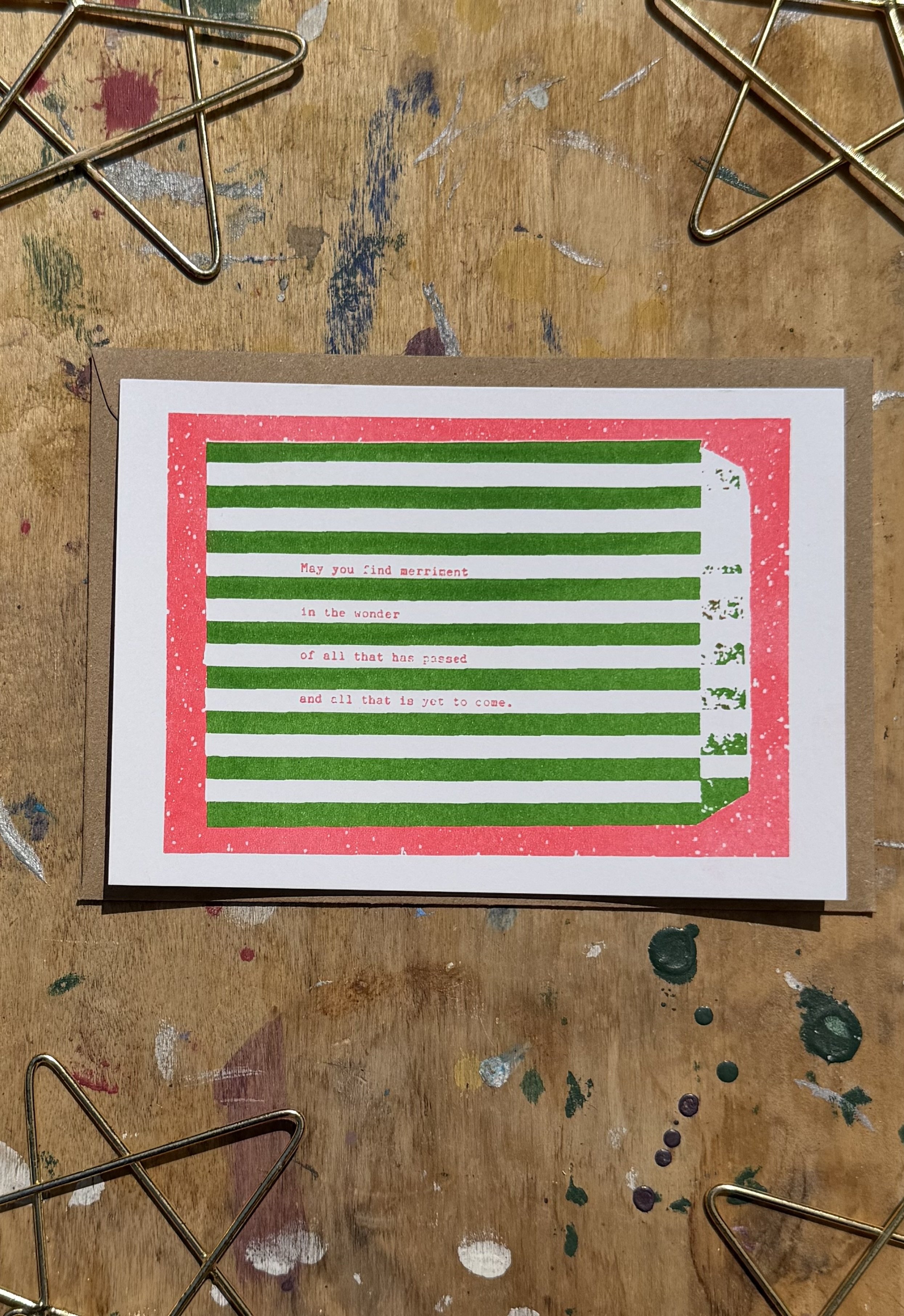 A6 risograph holiday card with red and green stripes and text. Indie made christmas cards from a small business.