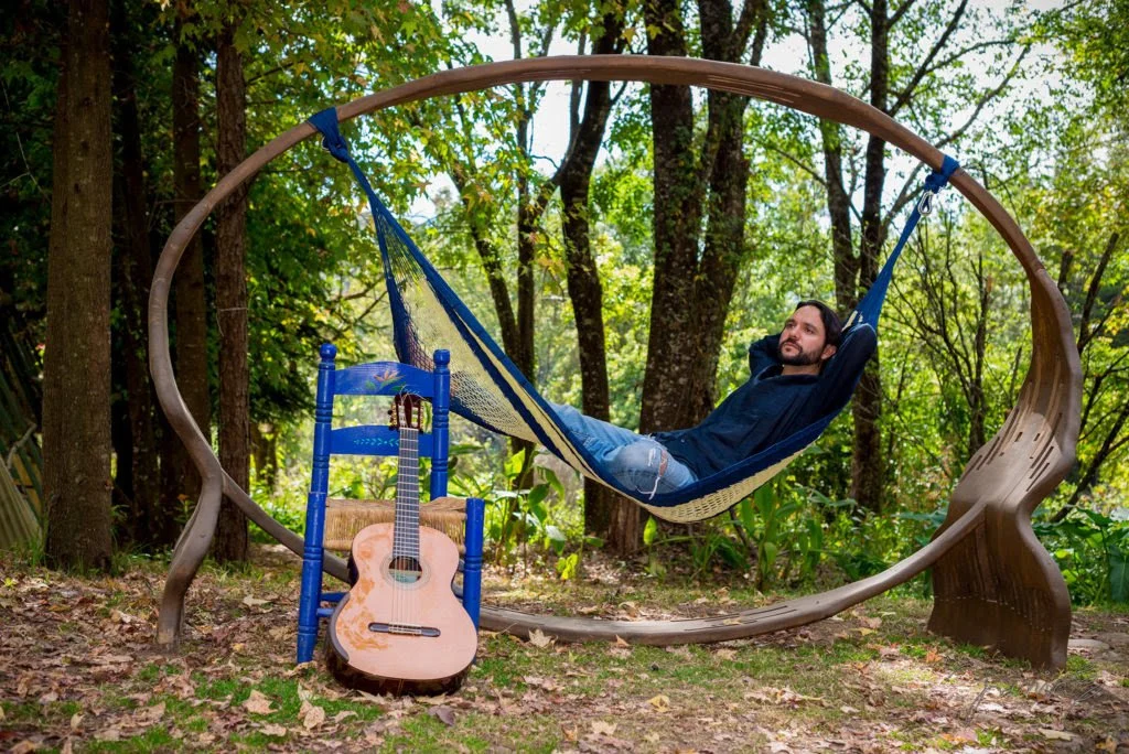 Guitarist Morgan Szymanski sitting in a hammock