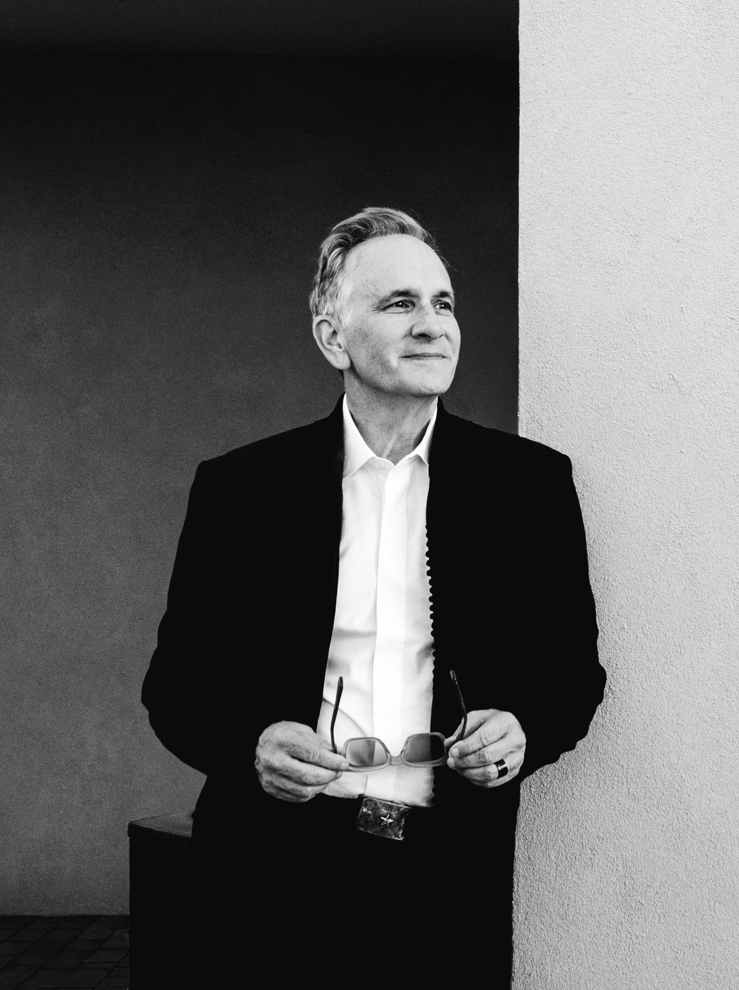 Peter Zandan holding glasses