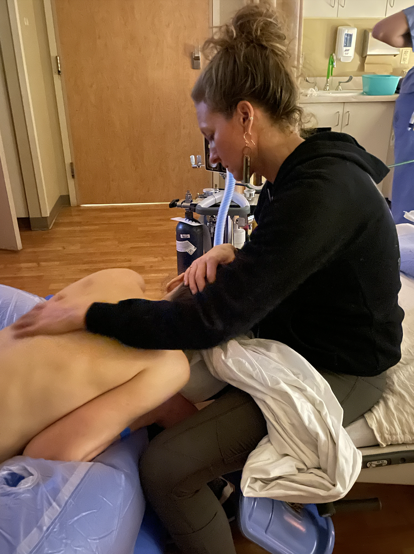 Jen Reed, Portland area Doula assisting a client during birth