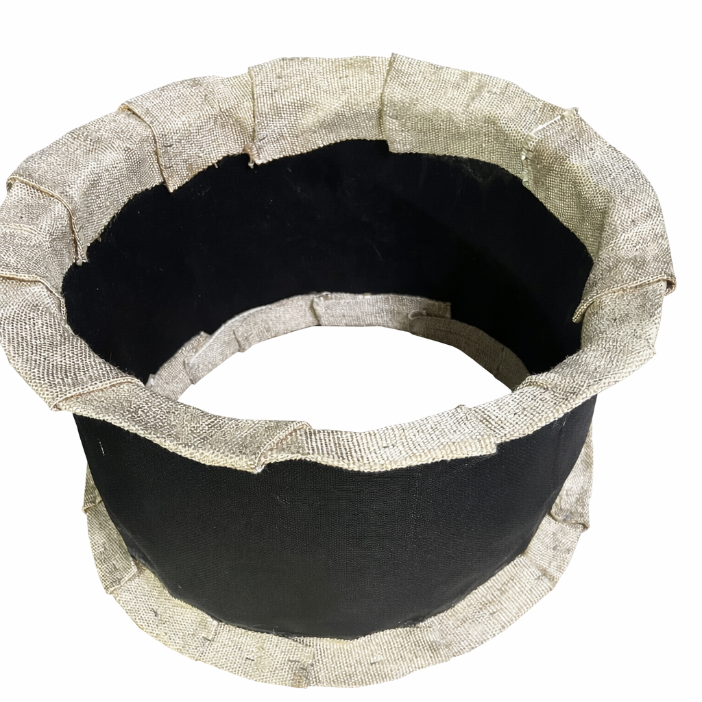 A black fabric cylindrical container with reinforced, beige cloth edging at the top and bottom.