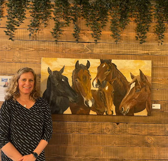 Gabrielle England at the Ballards Arts Walk at Aluel Cellars, pictured besides her horse painting.