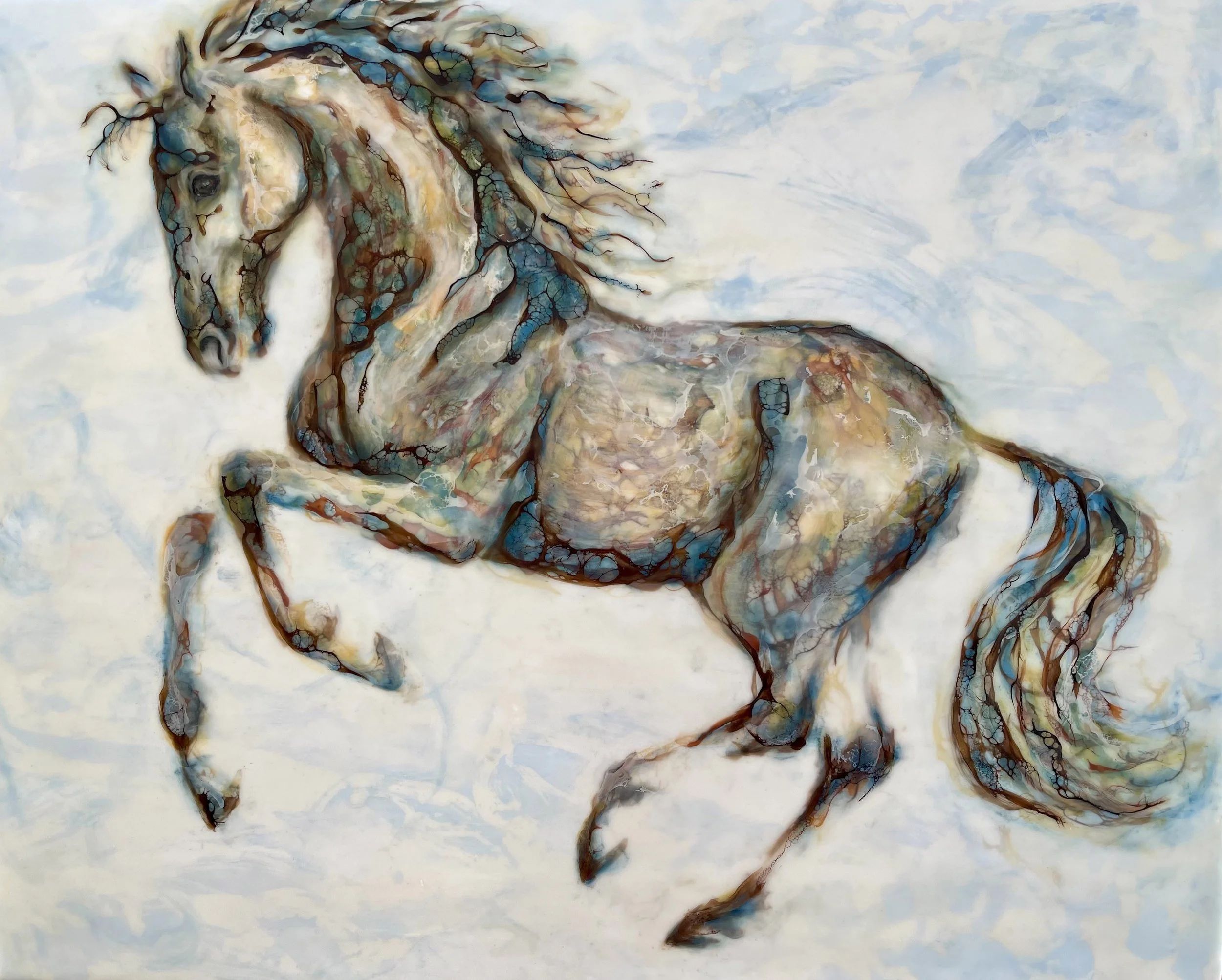 Encaustic mixed media horse painting in soft blues, showing a horse mid-stride with flowing mane and layered texture.