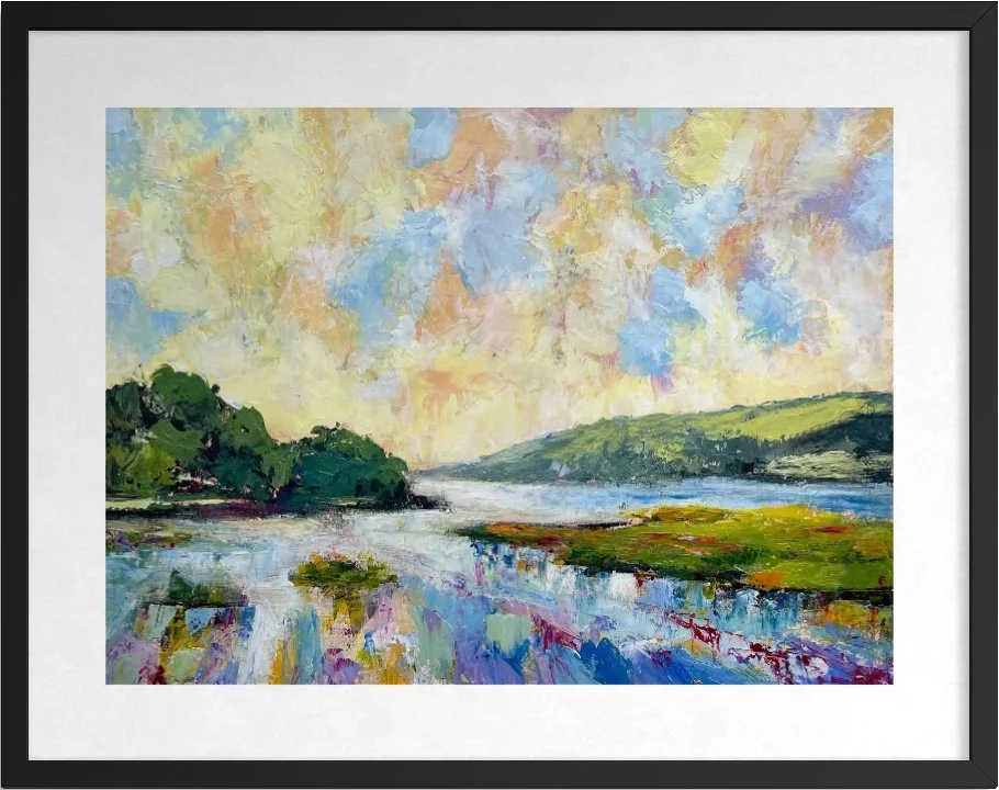 Framed Moring Light landscape painting in a black frame shown hanging indoors.