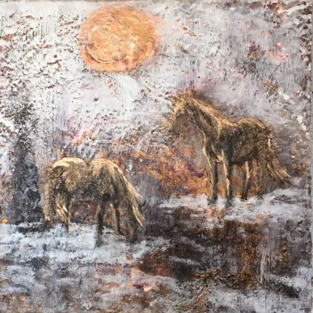 Encaustic mixed media painting of two horses standing in a winter landscape under a bright sun.