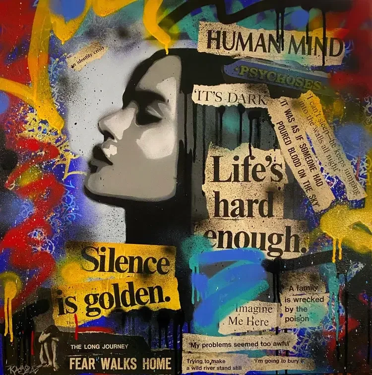 Graffiti art featuring a woman's face in profile with various text phrases and colorful abstract splashes. Prominent phrases include "HUMAN MIND," "Life's hard enough," and "Silence is golden." The artwork combines street art style with collage eleme