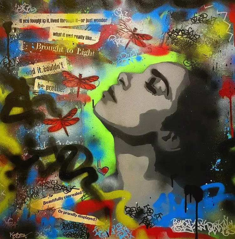 Street art mural of a woman's face in profile with closed eyes, surrounded by colorful graffiti, red dragonflies, and collage-style text snippets.