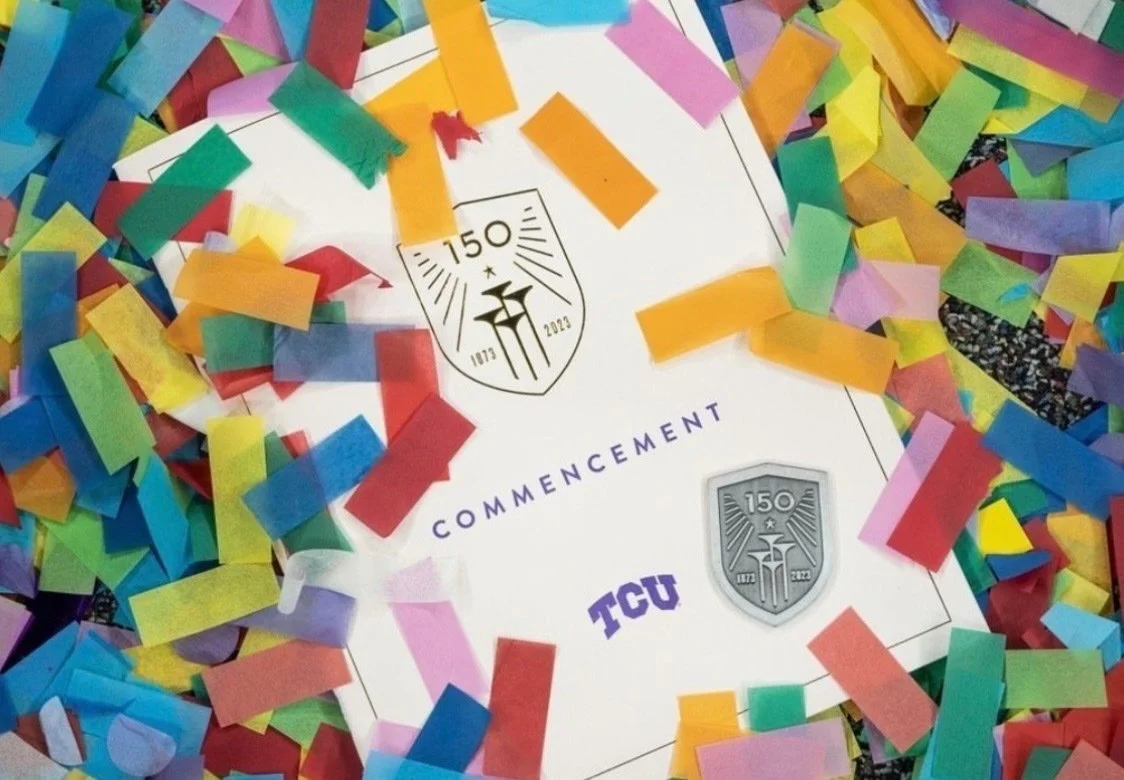 A graduation cap surrounded by colorful confetti celebrating TCU's 150th commencement in 2023.