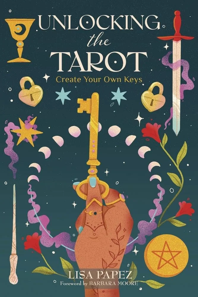 The Unlocking the Tarot book cover shows an illustrated hand holding a key surrounded by the suit symbols of tarot: wand, cup, sword, pentacle, as well as stars and flowers and the phases of the moon.