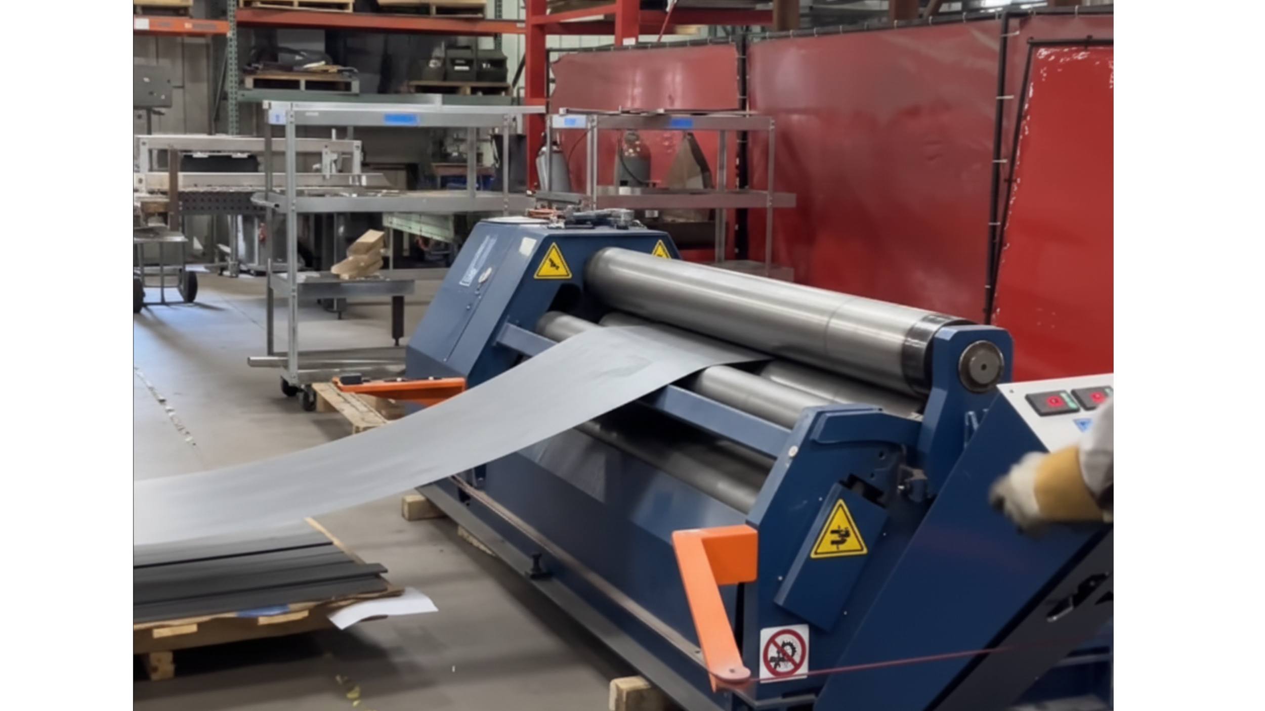 Industrial paper or film roll slitting machine in factory.