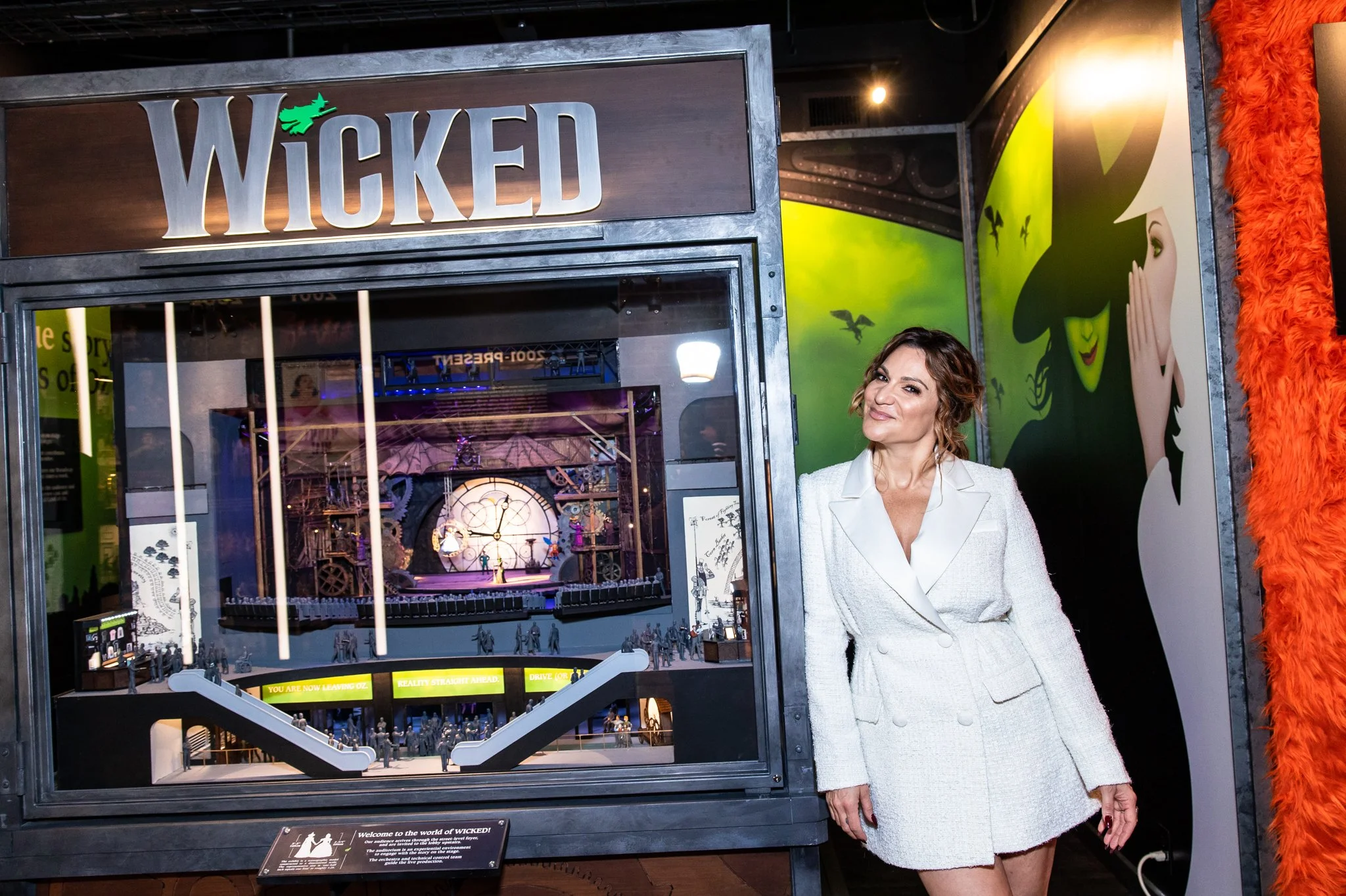 Shoshana Bean posing with a Wicked display at The Museum of Broadway opening preview 