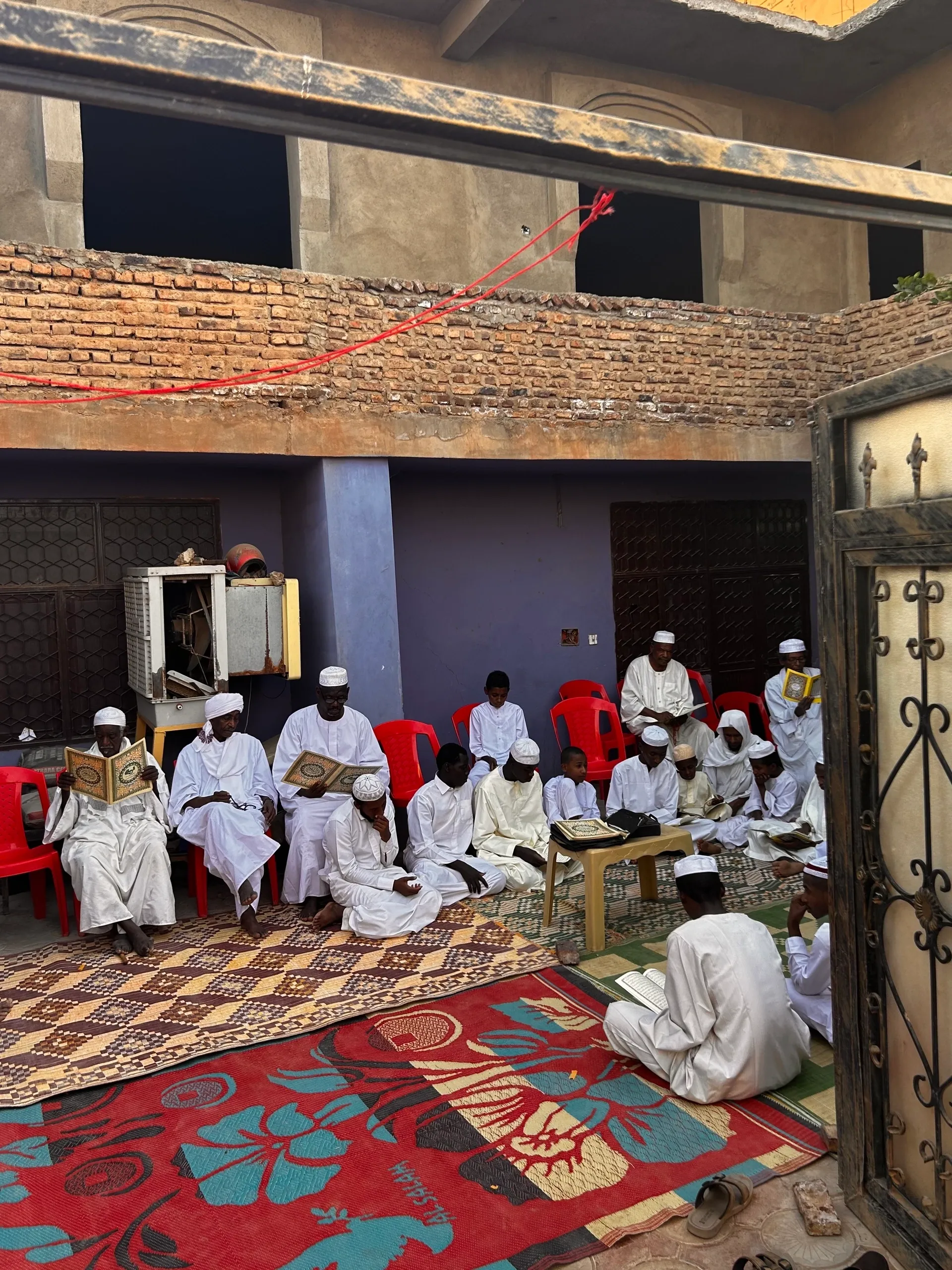 a reading of the quran at my grandmother's funeral. halfayat al muluk, khartoum. april 7, 2023. 