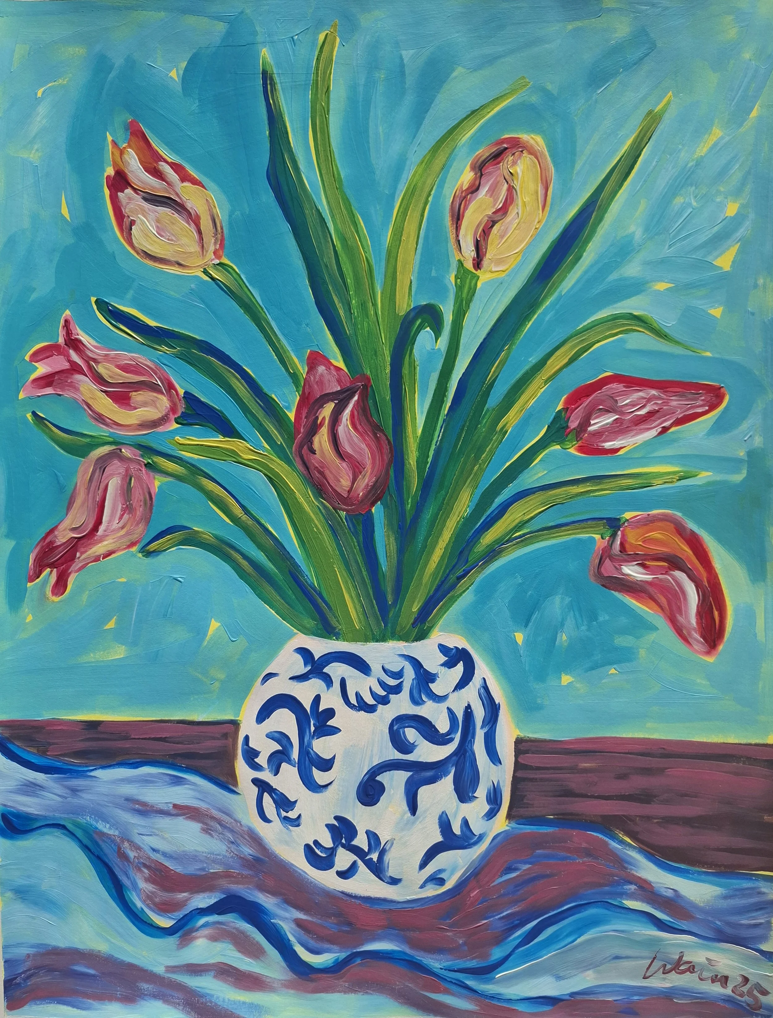 A colorful abstract painting of a bouquet of pink tulips with green leaves in a white vase with blue swirling patterns, set on a table with a blue and brown tablecloth or surface, against a blue background.