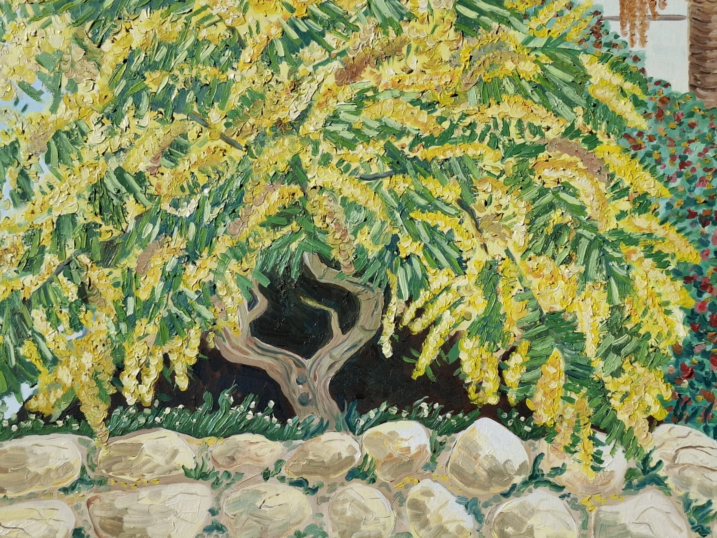 A painting of a vine with yellow flowers growing over a stone border, with a palm tree in the background.