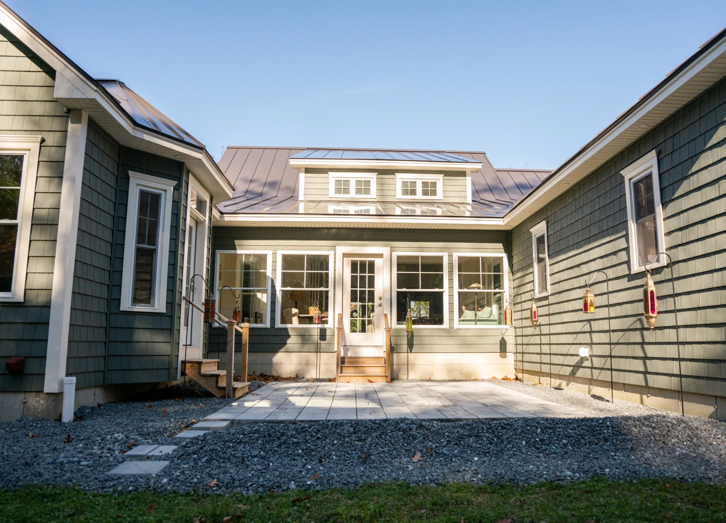 Courtyard patio between the wings leading into the four-season sunroom