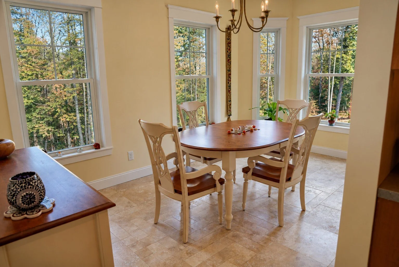 East-facing breakfast nook wrapped in windows for morning light