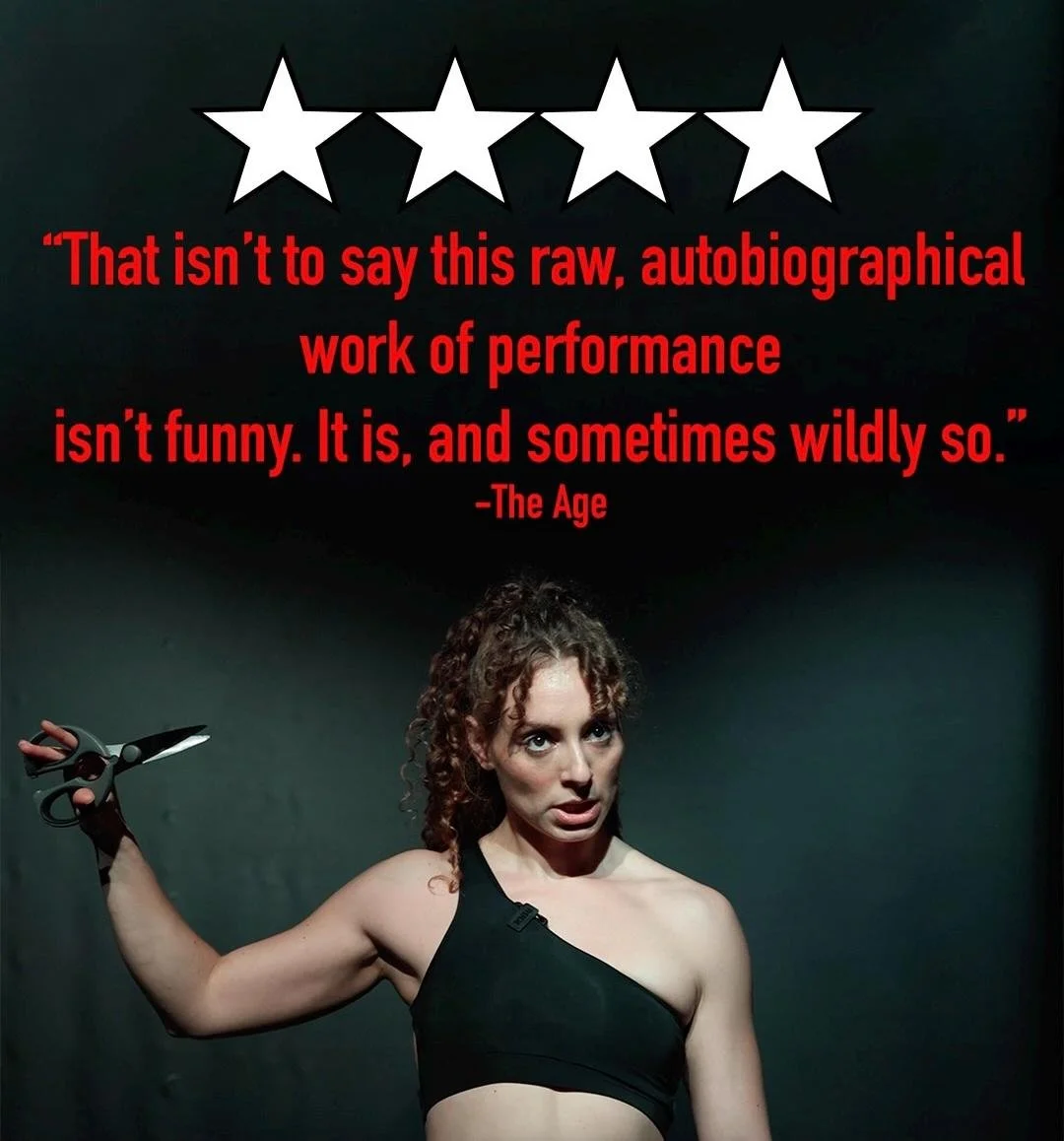 A woman with curly hair in a black one-shoulder top holding a pair of scissors, with a quote over her head in red text above her.