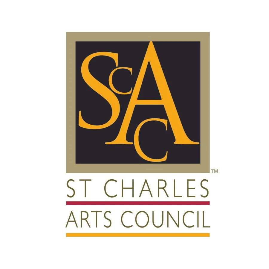 Logo of St. Charles Arts Council with large stylized letters S, C, and A in gold, black background, beige border, and text below reading 'St. Charles Arts Council' with red and orange lines.