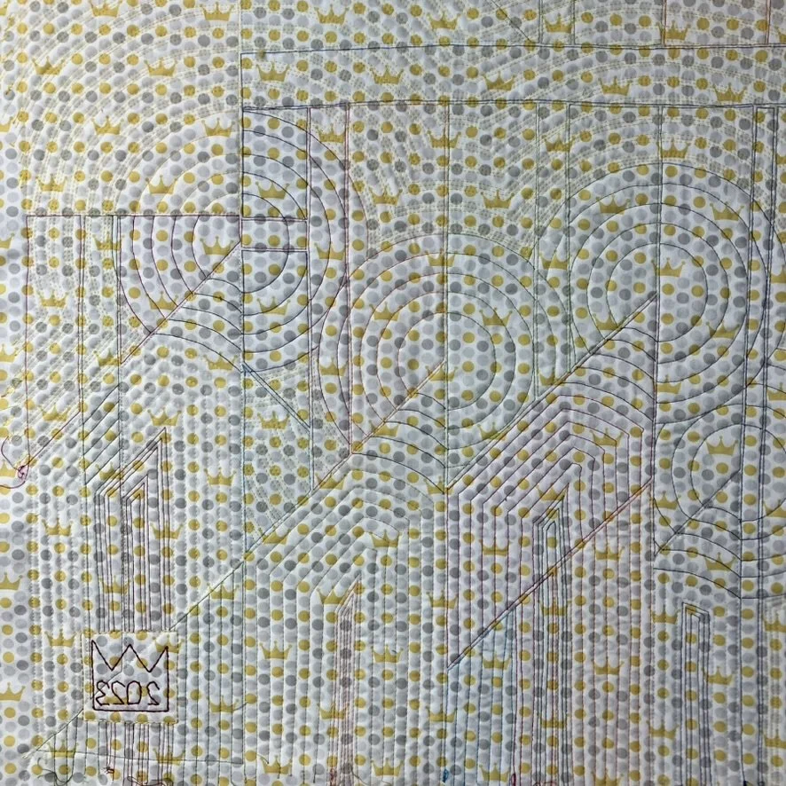 Back of the quilt showing the quilting.