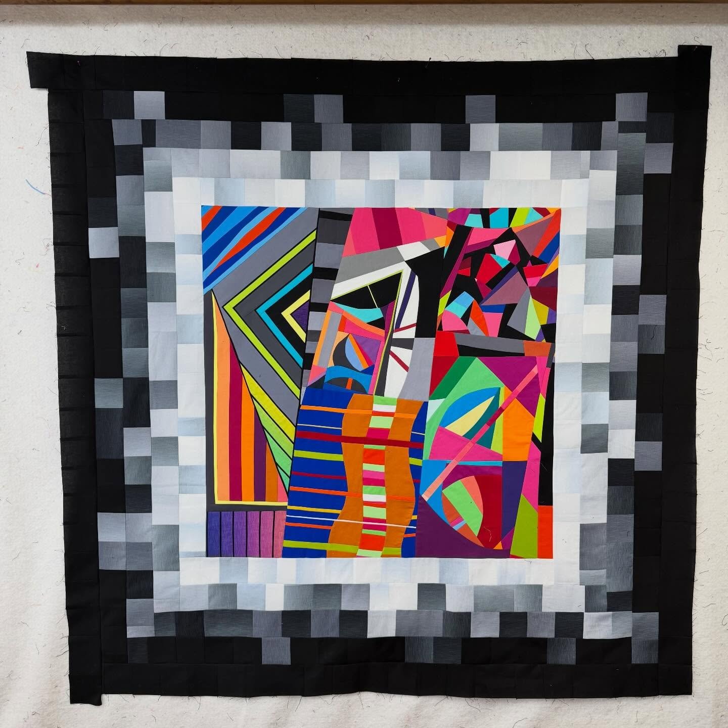 Just finished the top on this one. I am calling it Fragments of the Past. The size is 52.5 inches square.

The center is made from fragments of older projects and small design doodles pulled from different points in my quilting journey. All that colo