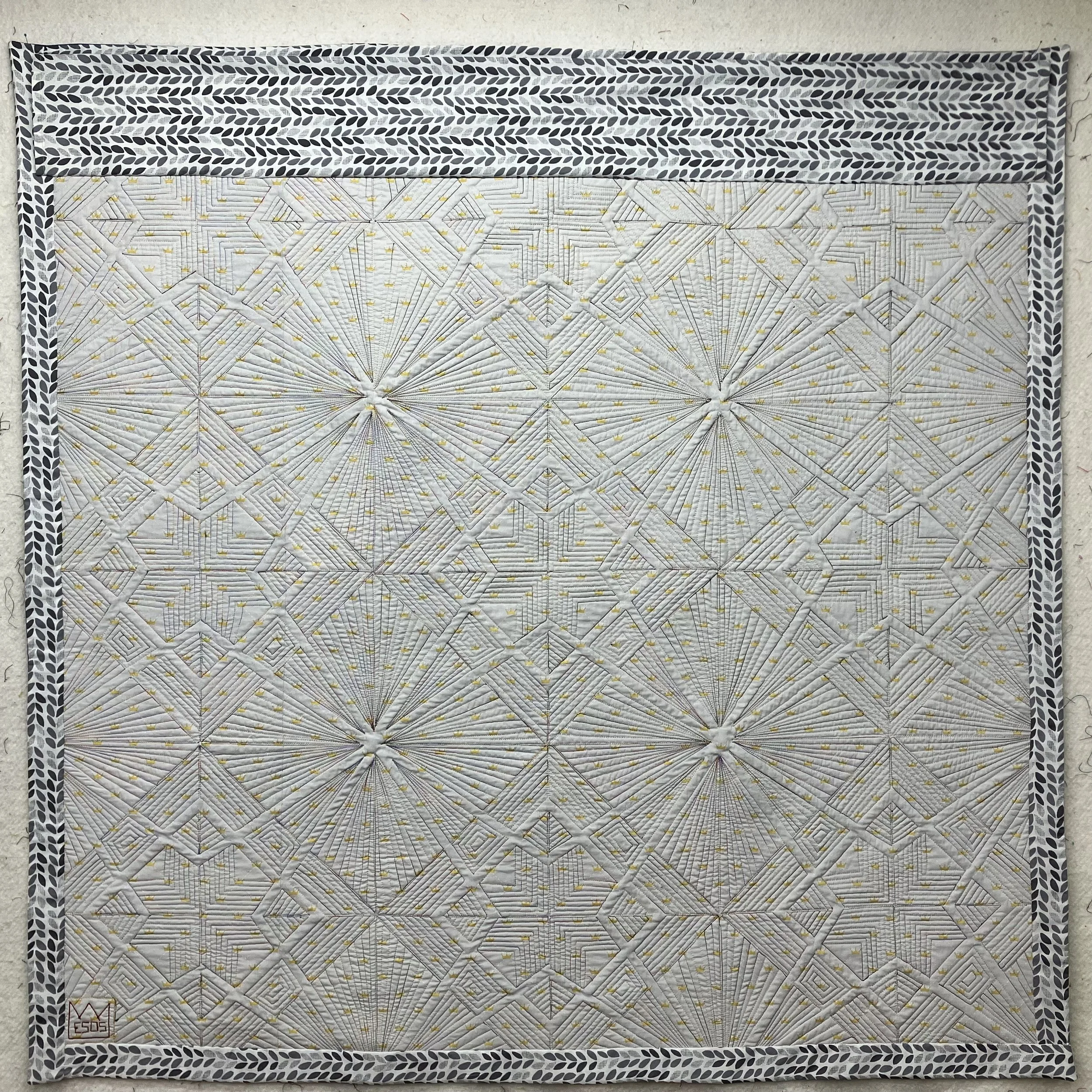 Full view of the back of Descent into Chaos, highlighting the quilting pattern and thread work.