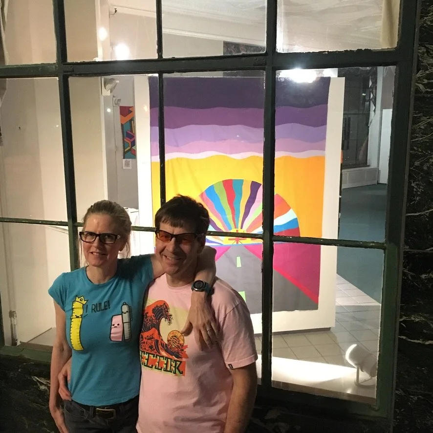 Kelley and I outside my solo exhibition Abstractions in Fabric at the Castleton Bank Gallery in Rutland, Vermont, 2018. Drive into the Sunset was exhibited as a completed top at the time.
