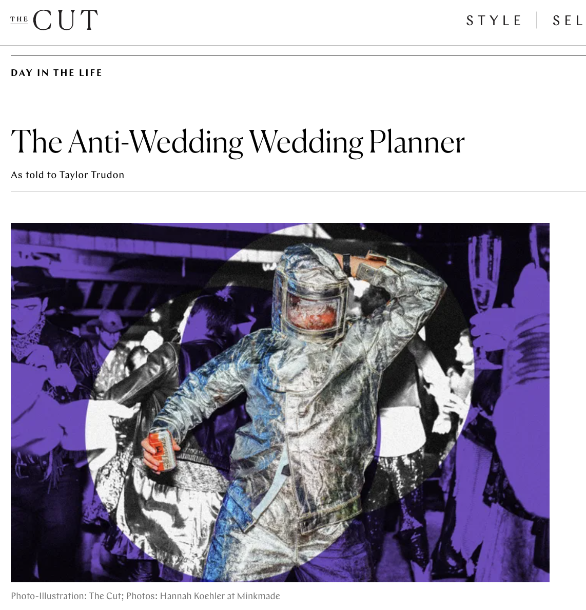 A person wearing a futuristic silver suit and helmet, holding a drink in a crowded, lively environment with purple lighting.