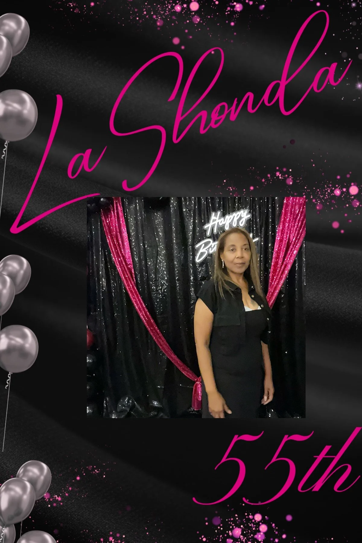 A woman standing in front of a black sequin backdrop with pink curtains and a neon 'Happy Birthday' sign, celebrating a 55th birthday.