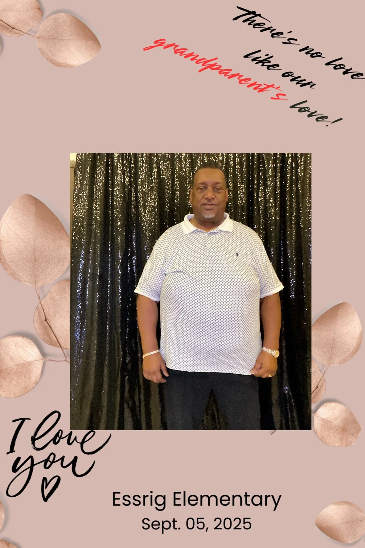 A man standing in front of a shiny black curtain, wearing a white polo shirt with small black patterns, black pants, and a watch, posing for a picture at Essrig Elementary on September 5, 2025, on a background with beige-colored leaves and inspiratio