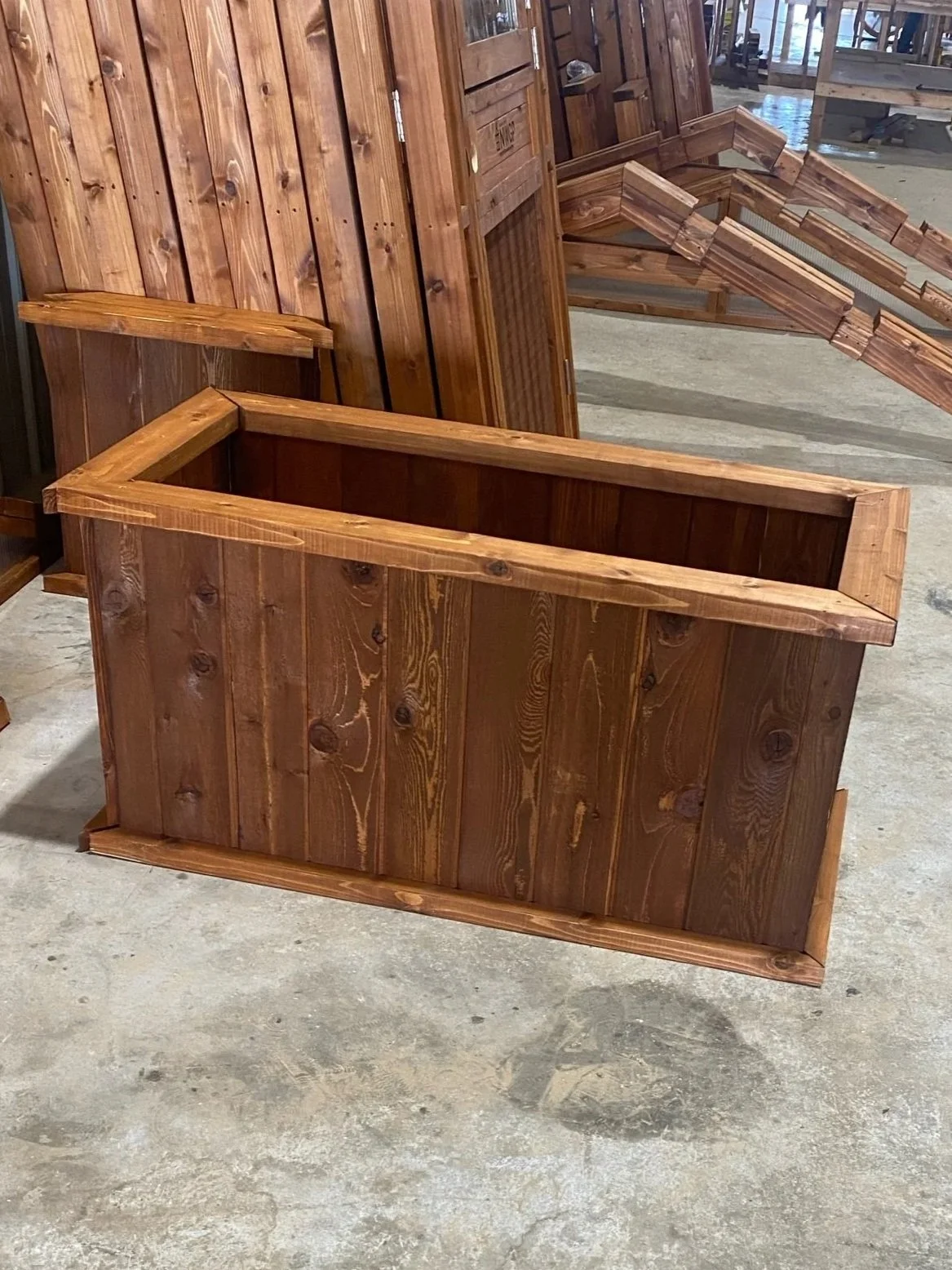 Tall stained wooden raised garden bed