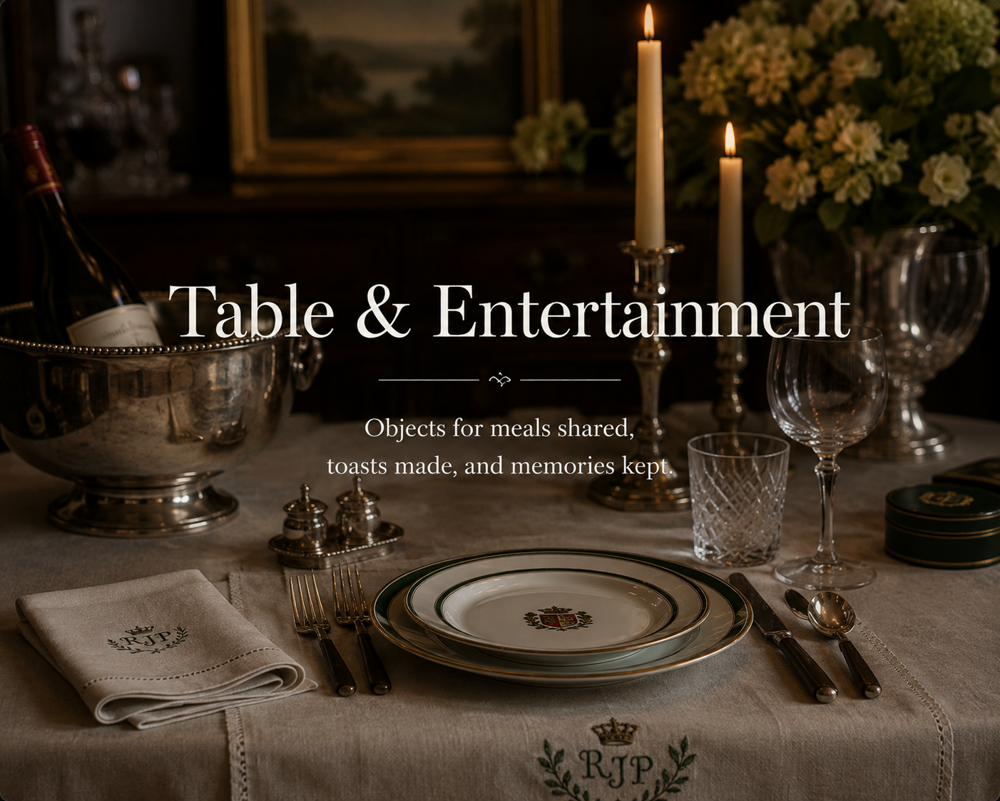 Elegant table setting with plates, glasses, silverware, candles, and floral arrangement, with a silver ice bucket holding a bottle, set for a formal meal.