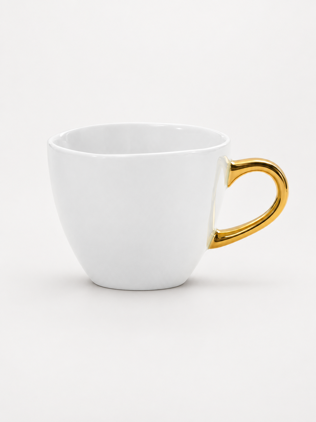 white and gold coffee cup.png