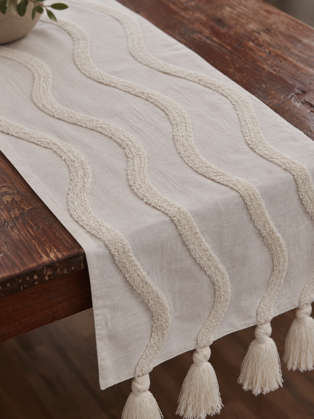 white table runner with decorative lines.png