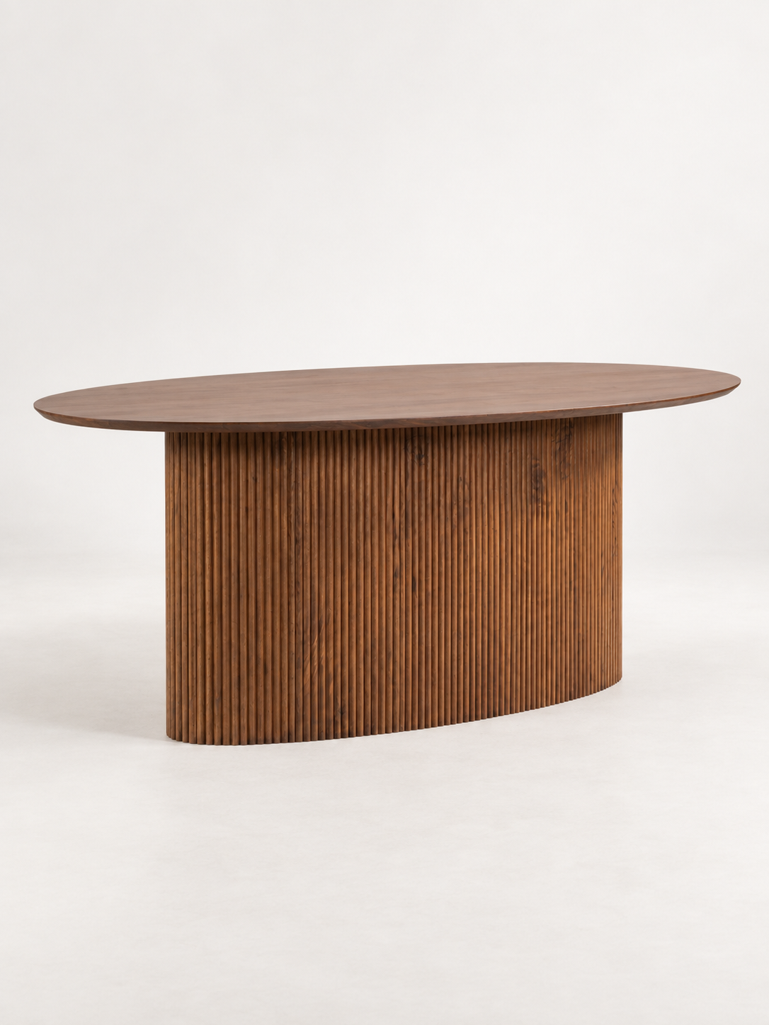oval acacia dining table side angle.png