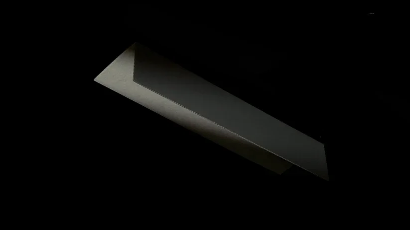 A rectangular opening in the ceiling with a recessed light fixture.