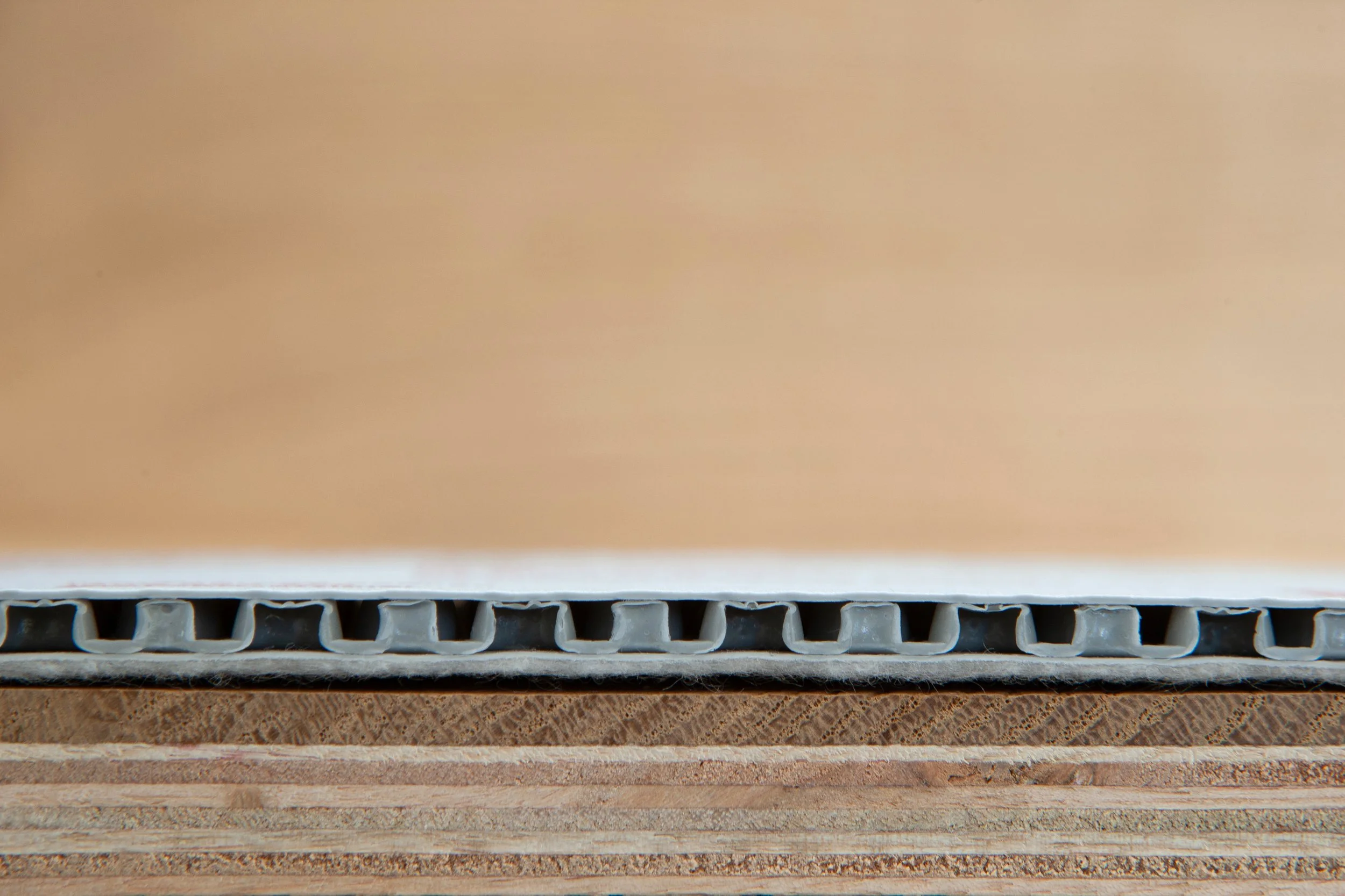 Close-up of cardboard boxes stacked on top of each other, showing the corrugated layers at the edges.