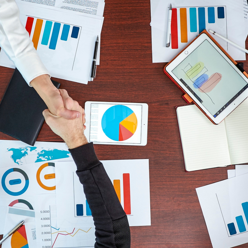 bookkeeper reviewing financial reports with charts