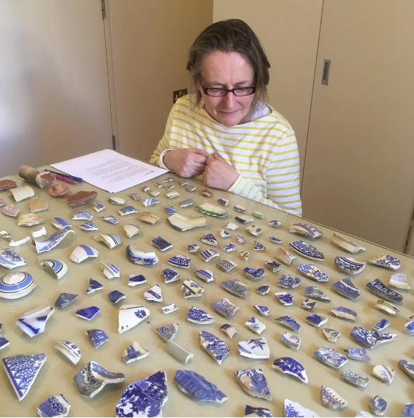 Jenny White the head of the Visual Arts Programme at the British Council viewing my collection of shards, Delfina Foundation, Victoria, London, 2017. Photo Joshua Lue Chee Kong